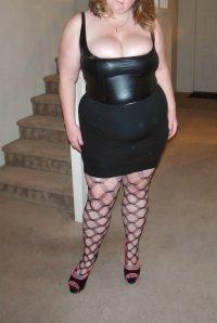 married redhead in black bustier black skirt stockings and heels.JPG