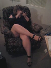 married redhead dressed to go out in minidress suntan hose and stripper heels.jpg