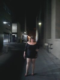 married redhead in minidress suntan hose and heels in a downtown alley at night.jpg