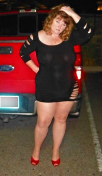 married redhead in my 'Hooker Minidress', suntan crotchless hose, no bra and 'Hooker Heels' in...jpg