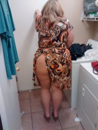 married redhead in a dress no panties, suntan crotchless hose, high heels dressed for a date.jpg