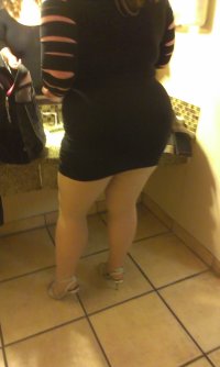 married redhead in my minidress, suntan crotchless pantyhose and heels getting ready for my da...jpg