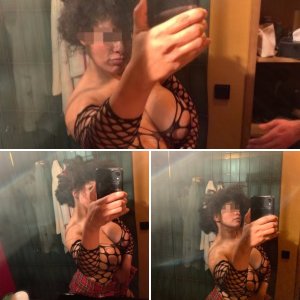 arrogant whore posing in front of mirror