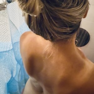 Wife showering tan lines