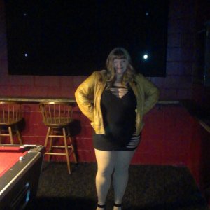 Married redhead in minidress at night at a pool hall bar