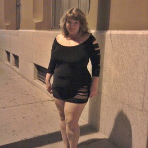 Redhead married in minidress walking downtown at night