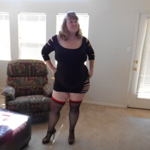 married redhead in minidress stockings and heels waiting on my date with my bull
