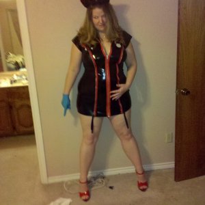 married redhead black spandex lingerie, garters and red pleaser stripper heels