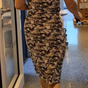 My mature colleague in a tight dress