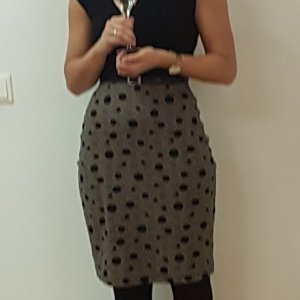 A colleague of my wife in a skirt